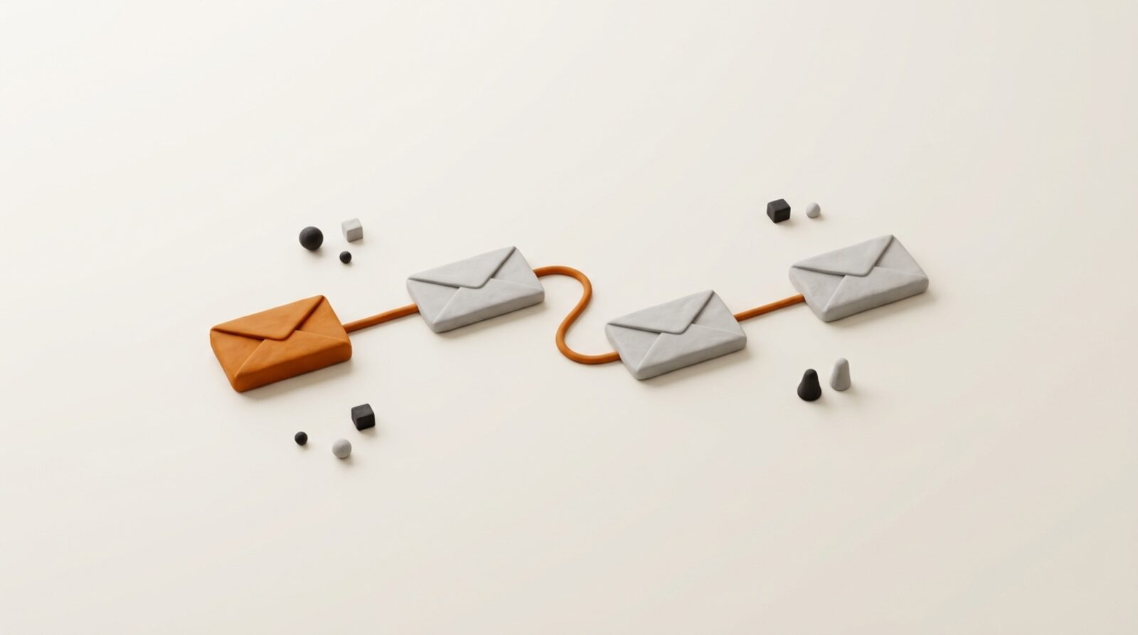 Four orange envelope shapes arranged in a flow on a warm grey surface