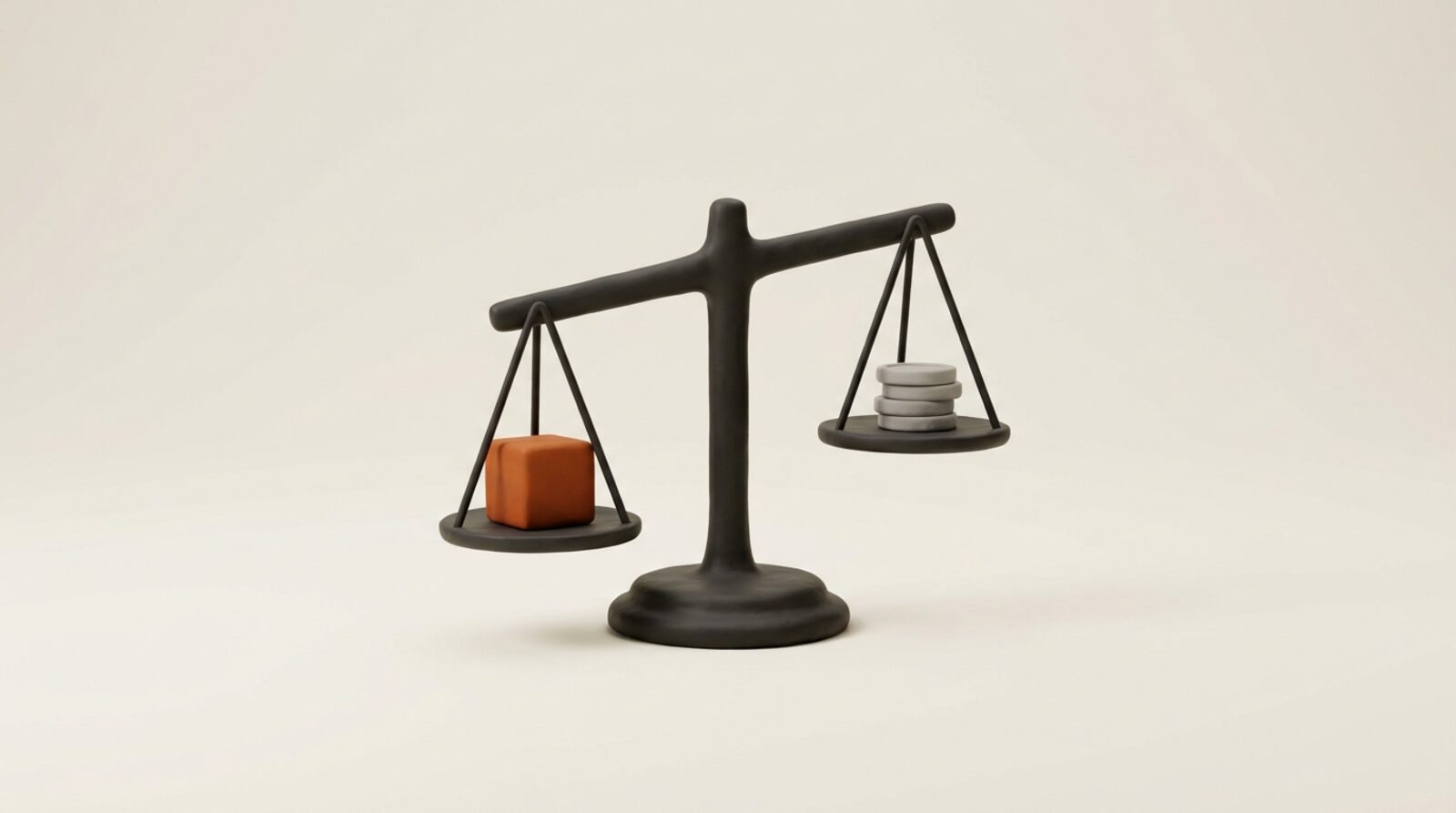 A balance scale weighing an orange cube against a stack of grey coins